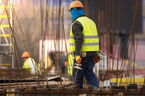 A man walks along a dangerous construction site in Salt Lake City.