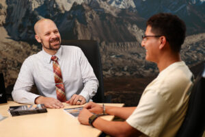 brigham speaking with a client about their personal injury case