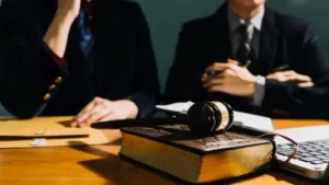 Closeup of two personal injury lawyers sitting at a desk.
