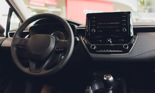 Modern car interior showing dashboard and steering wheel, often reviewed by a car accident lawyer when evaluating crash details.